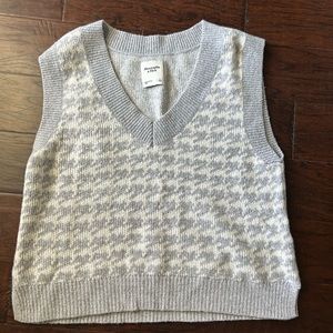 Gray and white houndstooth sweater vest
